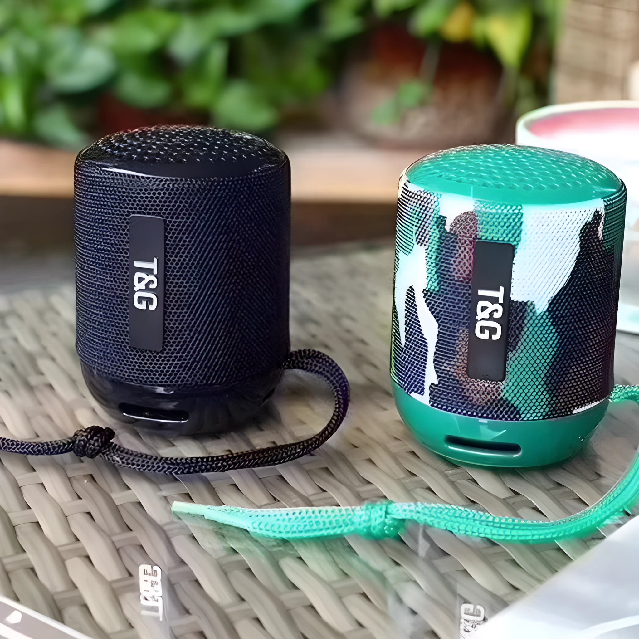 Wireless Bluetooth speaker in black, compact portable design with USB port and fabric grille