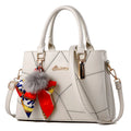 Ladies PU messenger bag with embroidery detail and soft handle in cross-section square shape