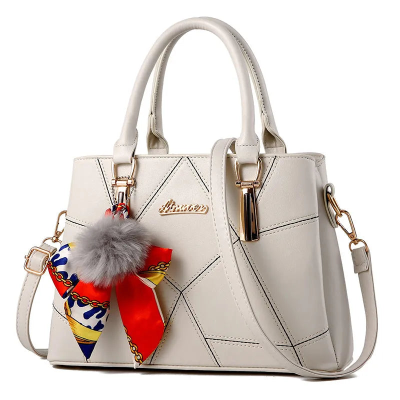Ladies PU messenger bag with embroidery detail and soft handle in cross-section square shape