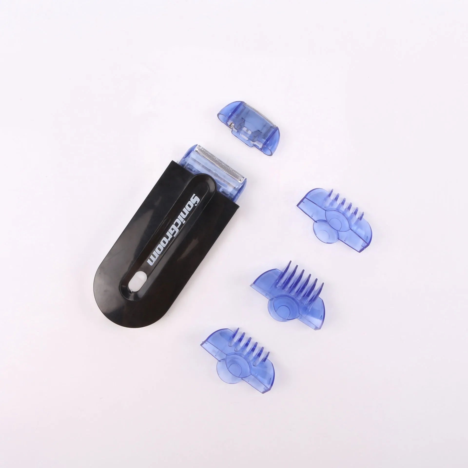 Black rechargeable electric hair remover with Sensa-Light head, trimmer head, foil head, USB cable and cleaning brush.