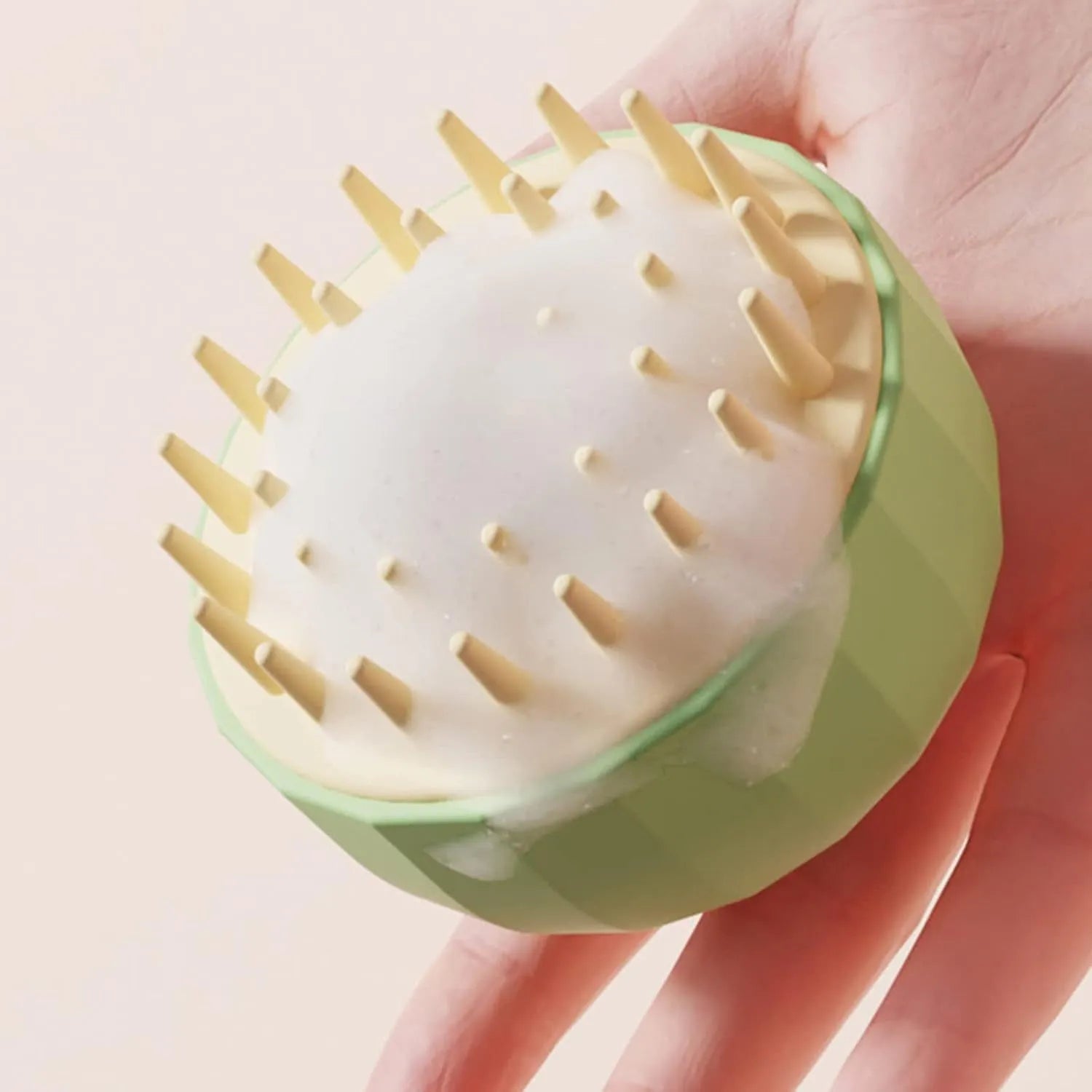 Green silicone pet bath brush with water drain holes and ergonomic handle for dogs and cats