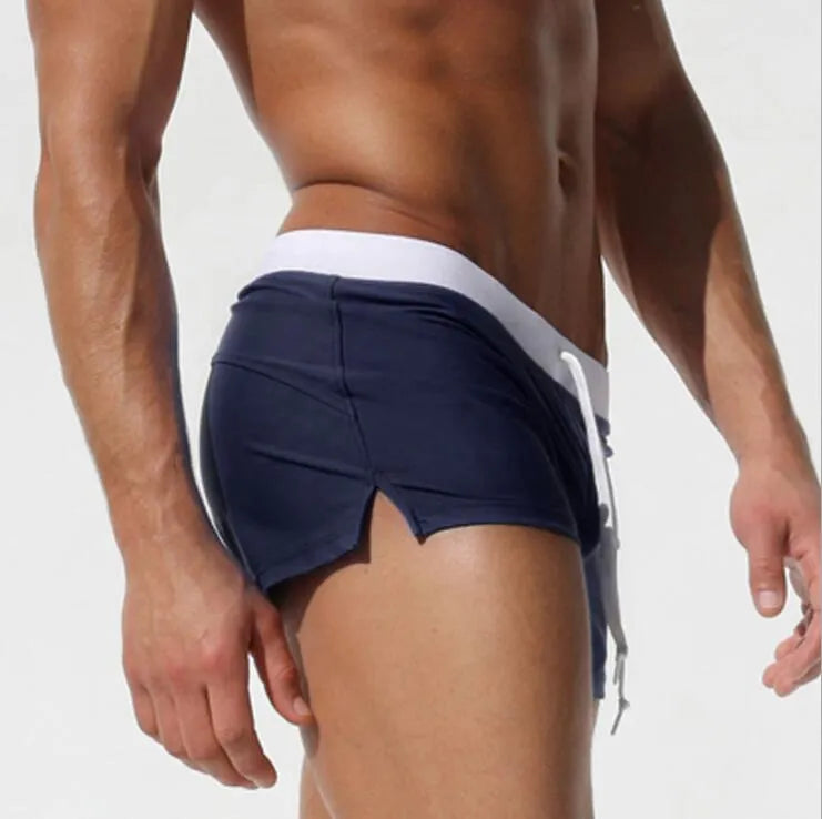 Cotton men sports shorts boxers in white, blue, navy, purple, green, and black for swimwear and beach use.