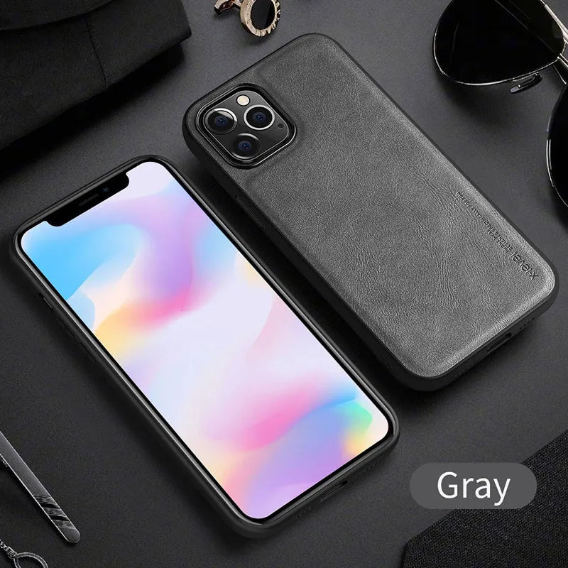 Black PU leather iPhone 12 phone case with soft TPU sides on a wooden table.