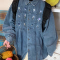 Vintage washed blue denim shirt with small floral print and pleated front on long sleeves