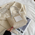 Women's retro style straw woven shoulder bag in black with large capacity and three-dimensional pocket