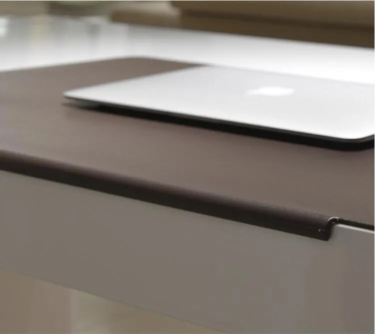 Black PVC non-slip computer desk mat 700x450x3mm on a desk with keyboard and mouse