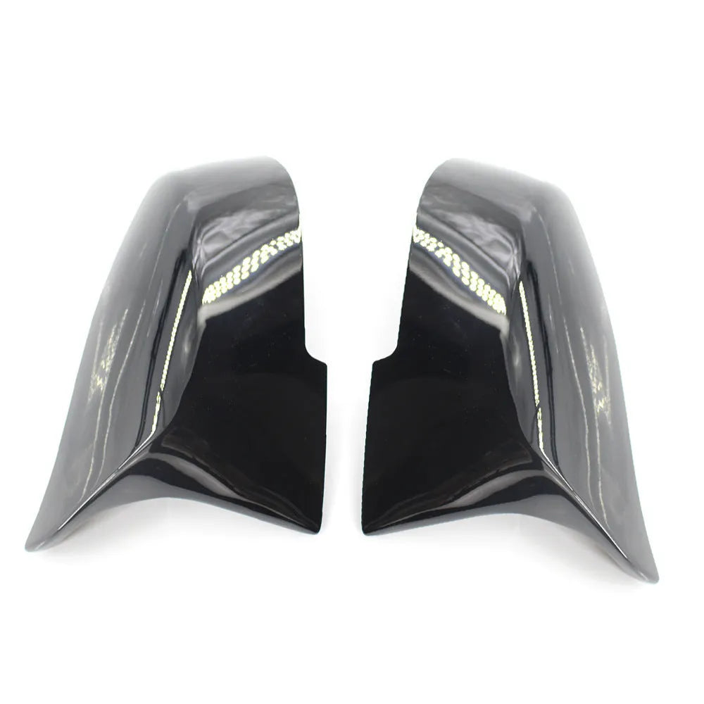 Pair of paint bright black BMW F-Series rear-view mirror replacement shells.