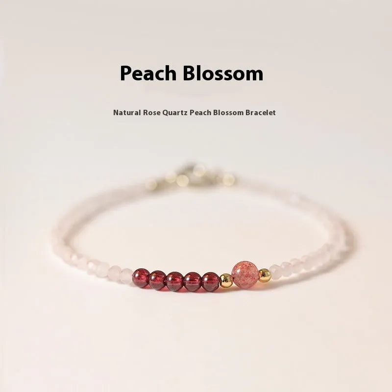 Handmade pink crystal bracelet with strawberry quartz beads and a zodiac animal charm
