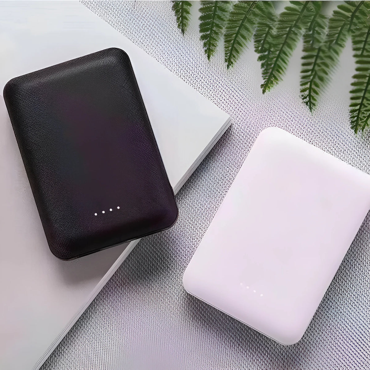 Portable mini 5000 mAh mobile power supply in black with multi USB port output