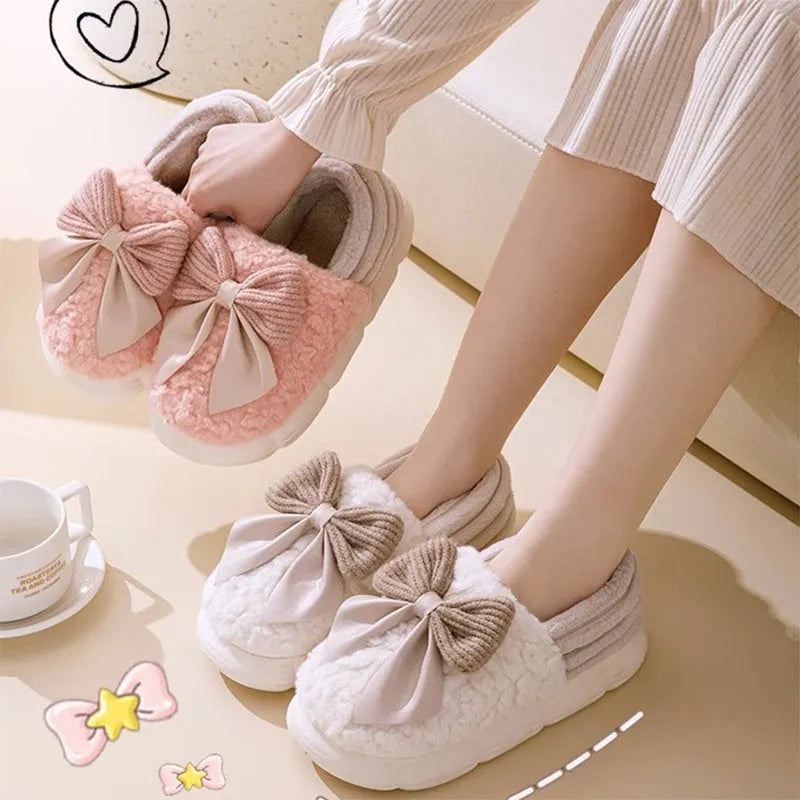 Big bow-knot fluffy slippers with covered heel in pink colour on floor