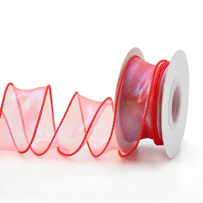 Roll of colourful fishtail yarn mesh decorative ribbon showing wave texture and multiple colour options
