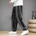 Men's striped casual trousers in black and navy blue options showing mid waist design