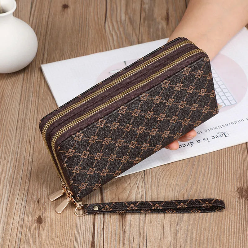 Long black PU leather wallet clutch with retro styling, open to show mobile phone compartment and coin purse sections