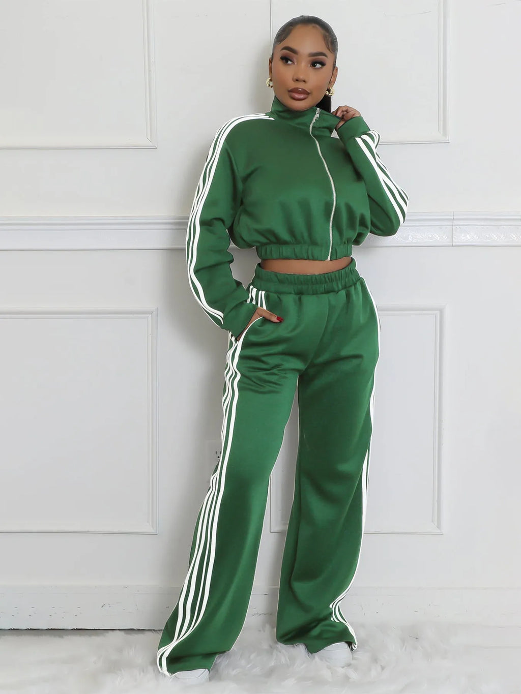 Grey striped men's zipper sweater and trouser two-piece co-ord set on a model.
