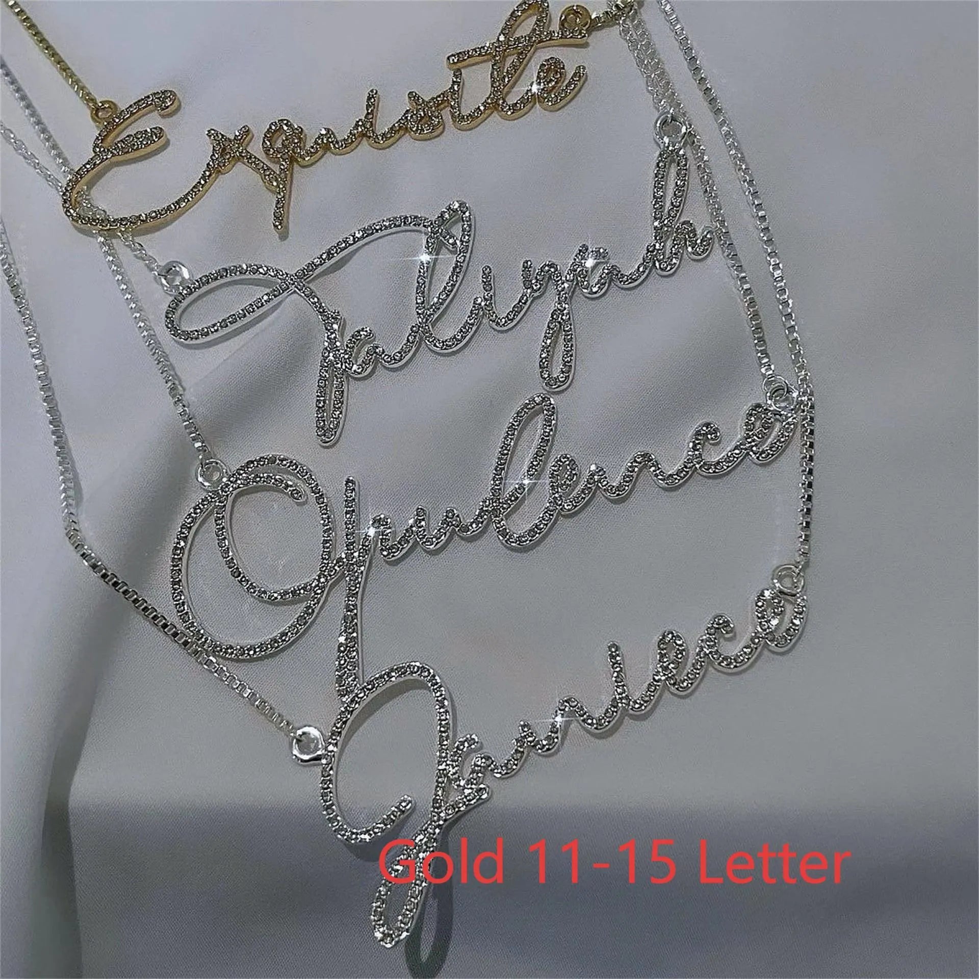 Stainless steel personalised name necklace with diamond studs on a silver chain, showing the letter 'A'.