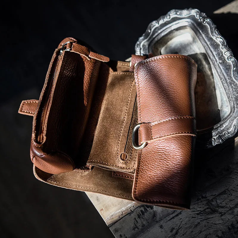Handmade dark brown cow leather vintage bifold wallet with tape extraction closure, shown open.