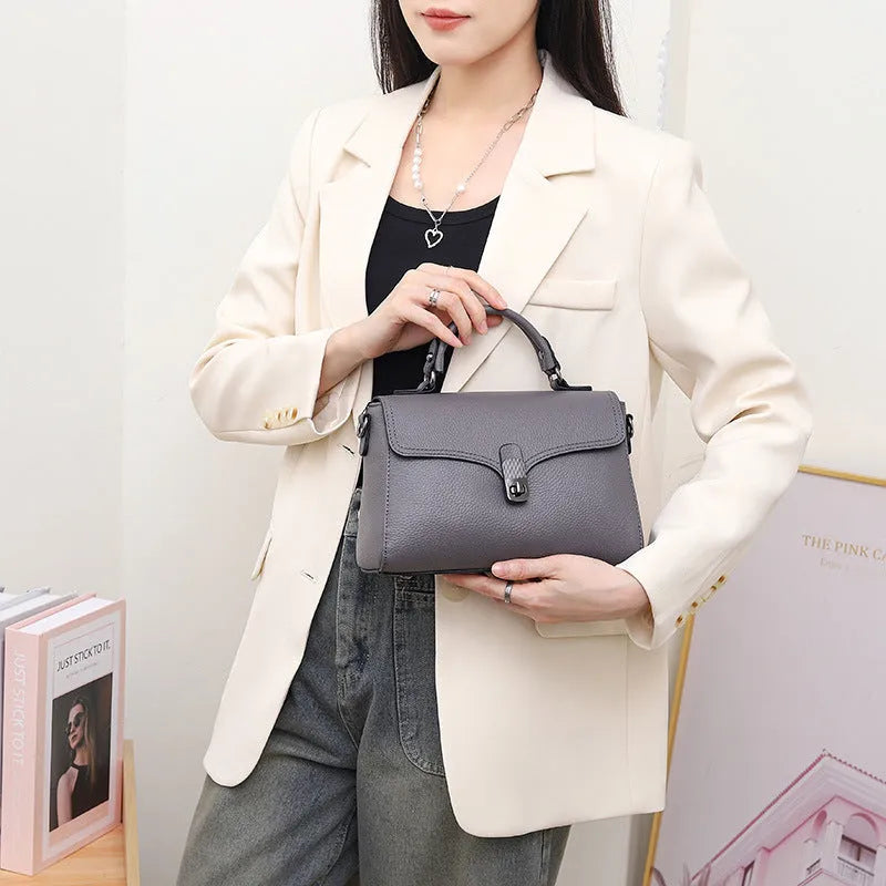 Korean commuter women's cross-body bag in genuine leather, oval shape, sandwich pocket, 21x18x9cm