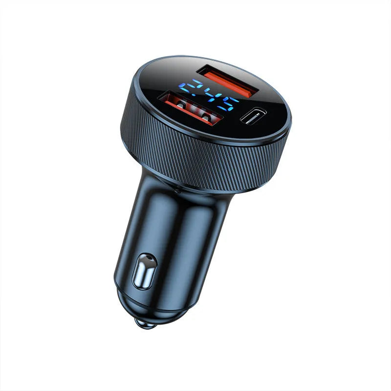 Black and iron grey aluminium alloy car charger with digital display plugged into a vehicle cigarette lighter