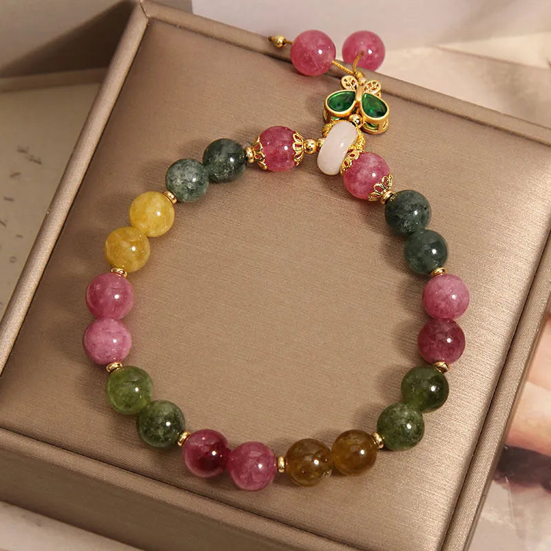 Women's tourmaline bracelet with a natural jade colour butterfly pendant and rhinestone details.