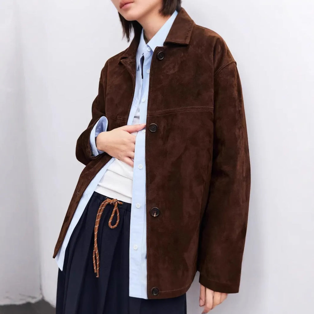 Women's caramel mocha cashmere coat with leather stitching and peter pan collar in art retro style