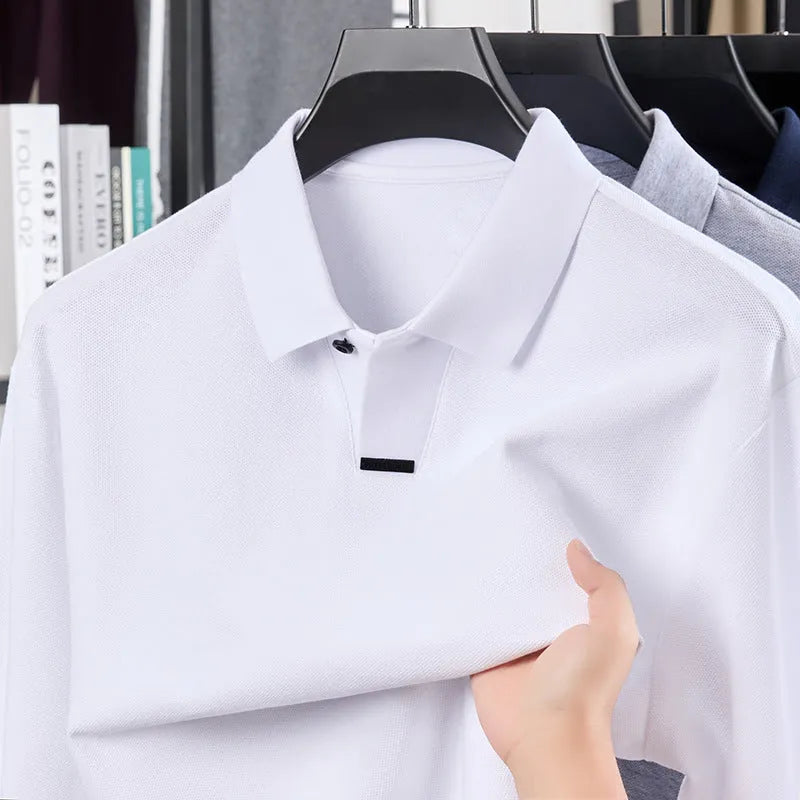 Men's grey loose fit cotton polo shirt with long sleeves and a lapel collar on a hanger.