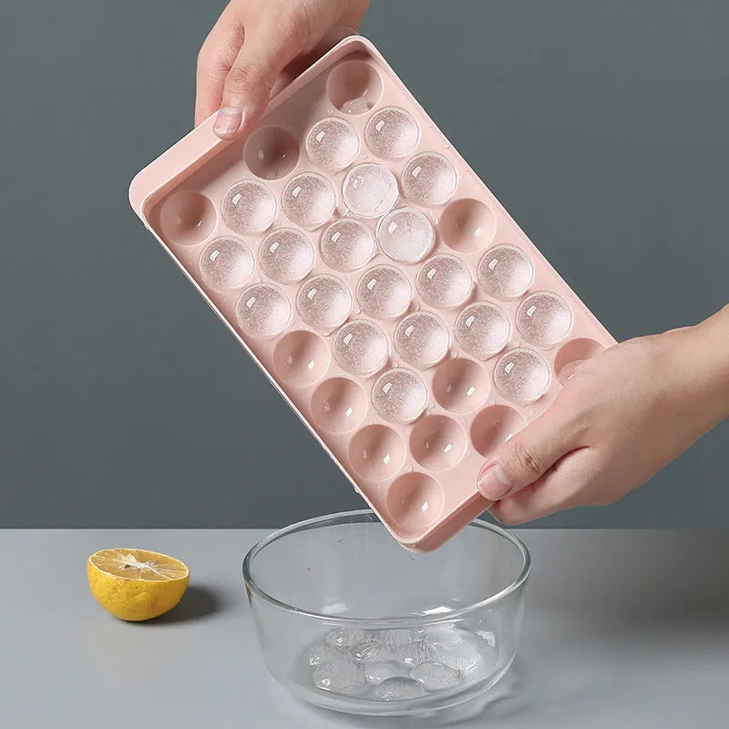 Sky blue or pink plastic ice cube tray making round ball ice for drinks.