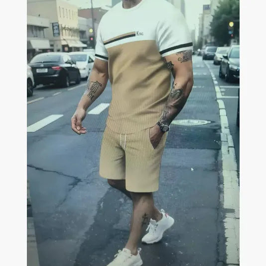 Man wearing a loose fit light blue short-sleeved t-shirt and matching shorts summer set.