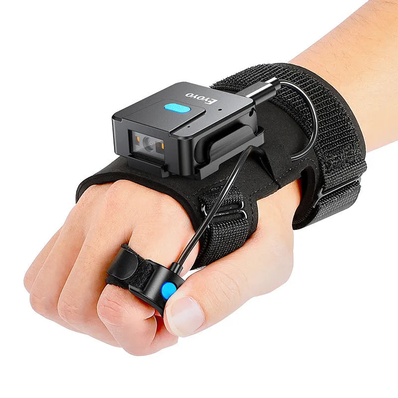 A person wearing a Bluetooth barcode scanner mounted on a wrist glove, scanning a product package.