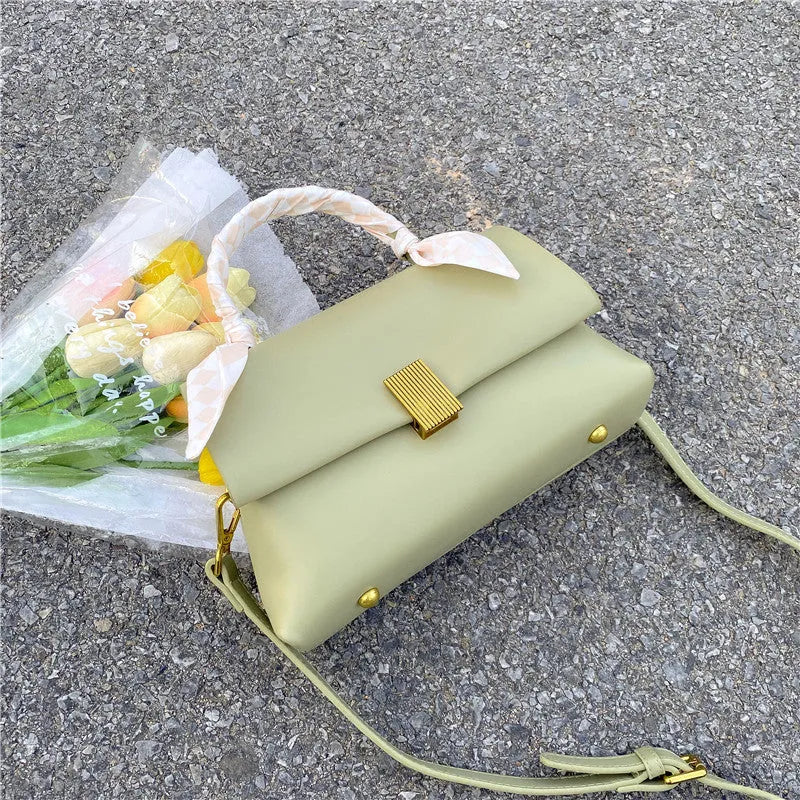 Medium-hardness PU shoulder handbag in horizontal square shape with visible sewing thread detail, black colour option