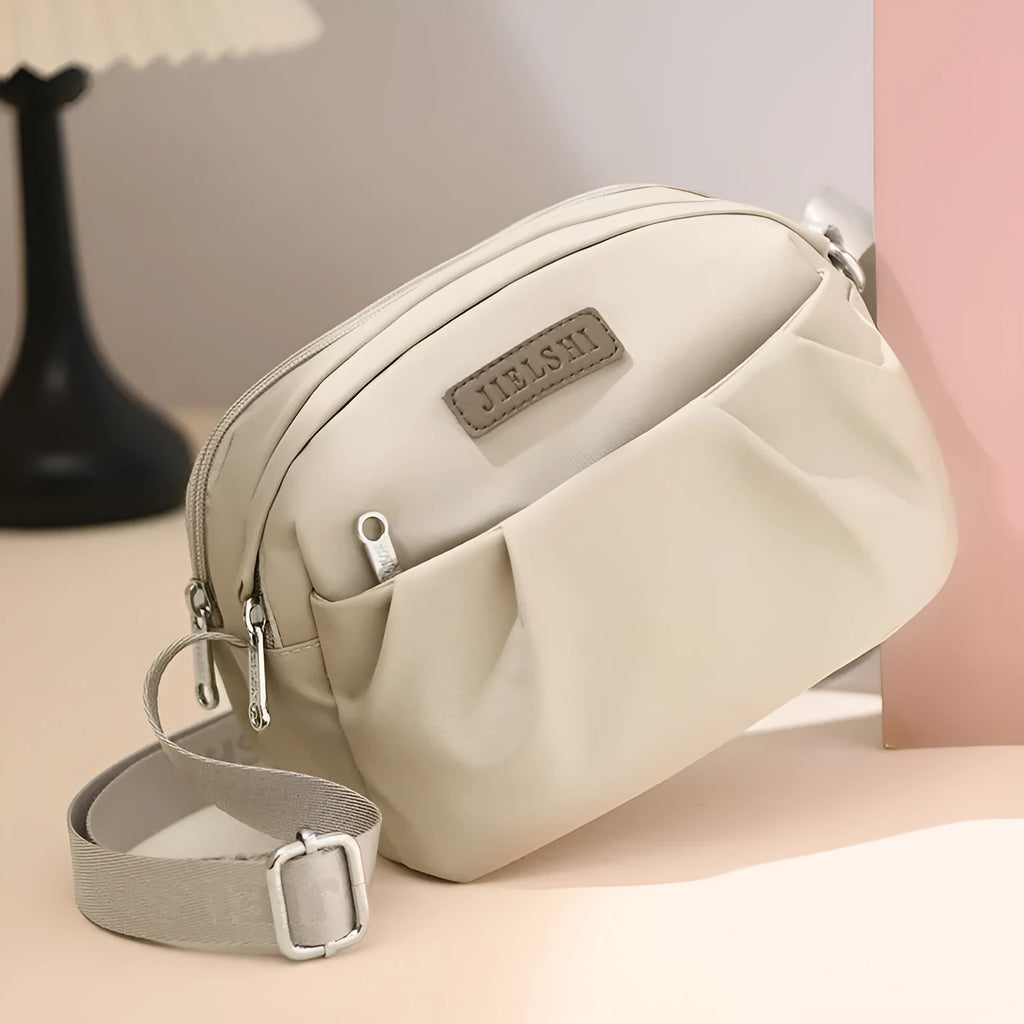Pleated Oxford cloth shoulder messenger bag in horizontal square shape with crossbody strap
