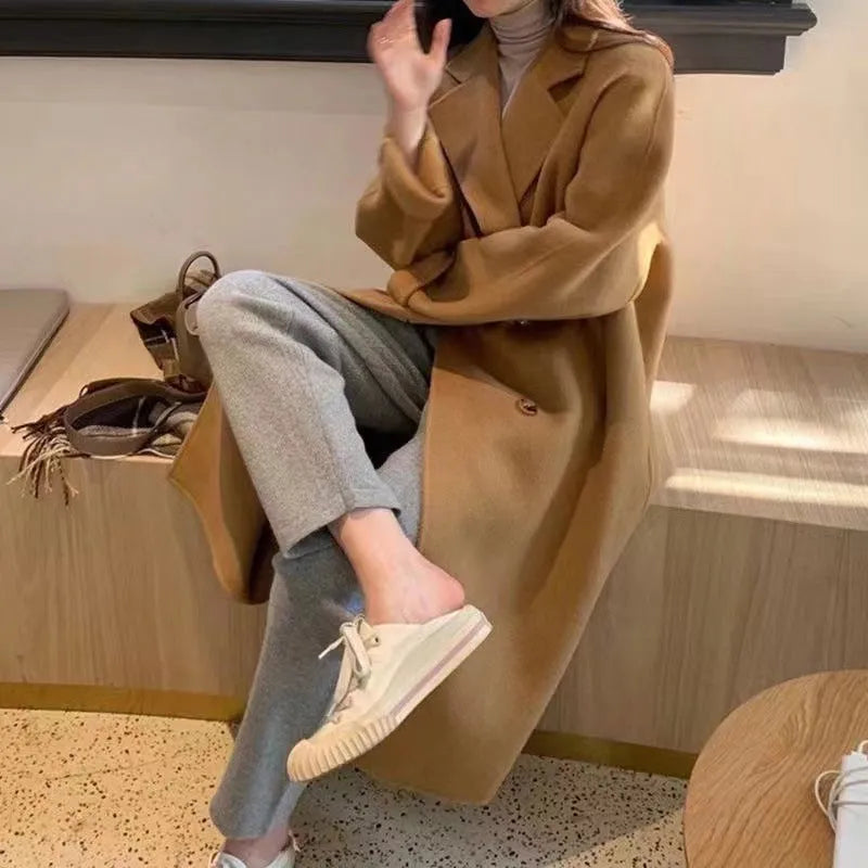 Women's high-grade woolen coat long sleeve in black colour, conventional sleeve design for casual winter wear