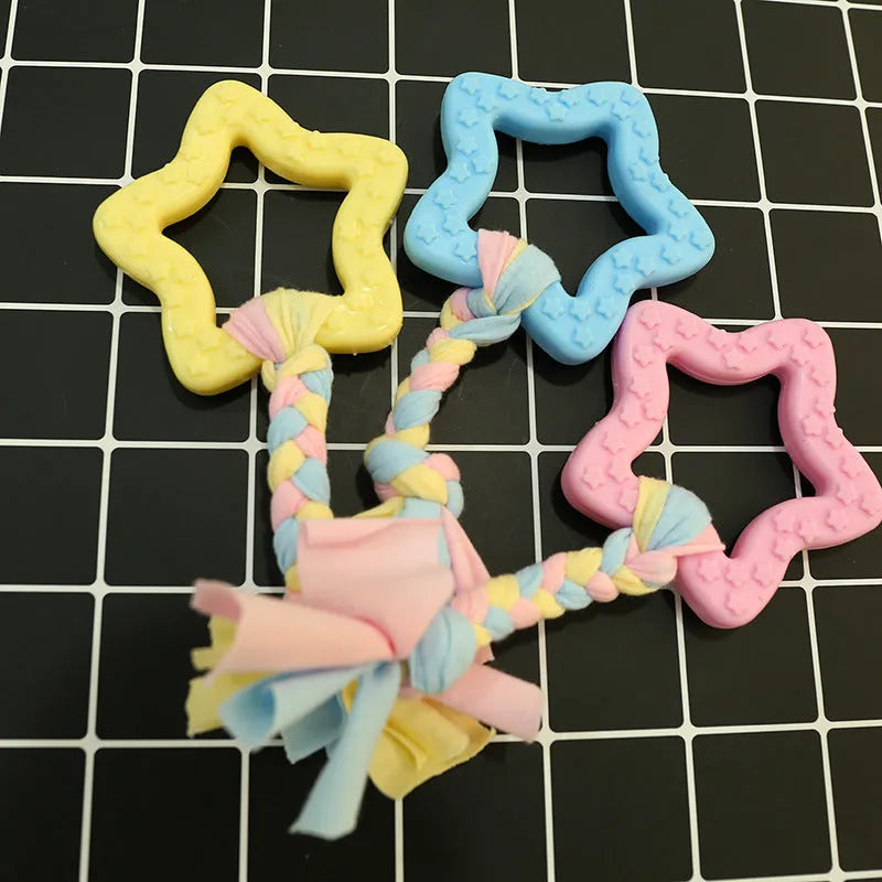 Non-toxic rubber dog chew toy in star shape with textured surface for teeth cleaning