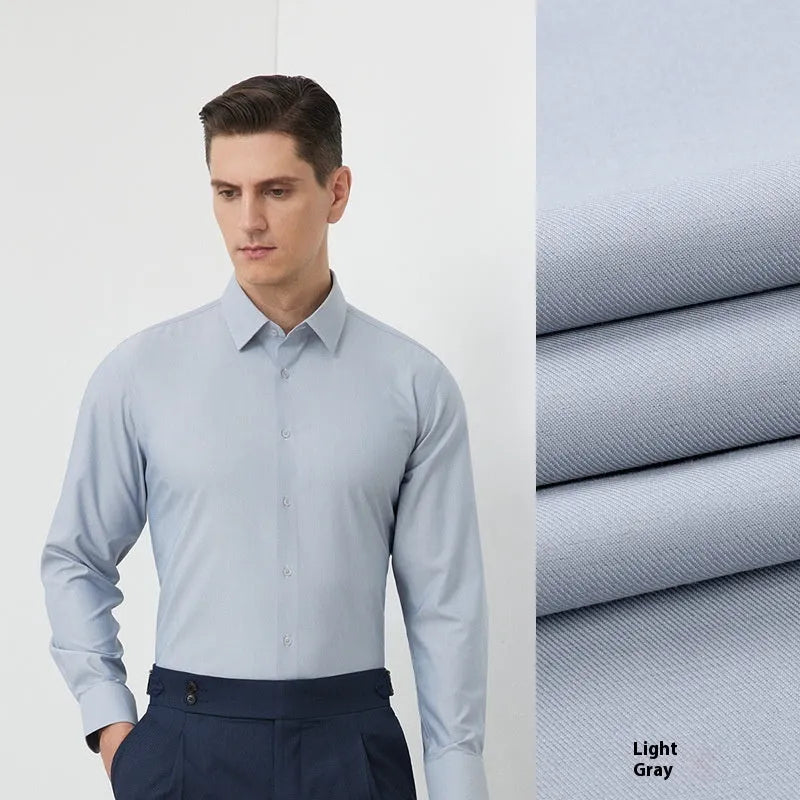 Man wearing a light blue long-sleeved non-iron business casual shirt with a regular fit.