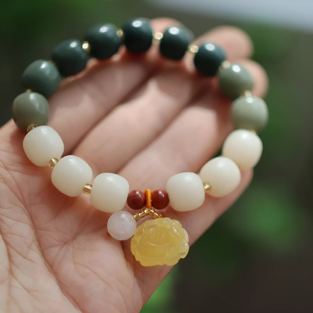 Gradient white jade Bodhi root bracelet with natural beeswax lotus charms, 10mm flower shape