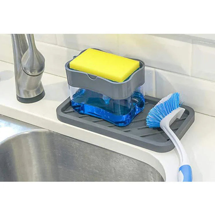 Plastic kitchen soap dispenser in silver colour on a countertop