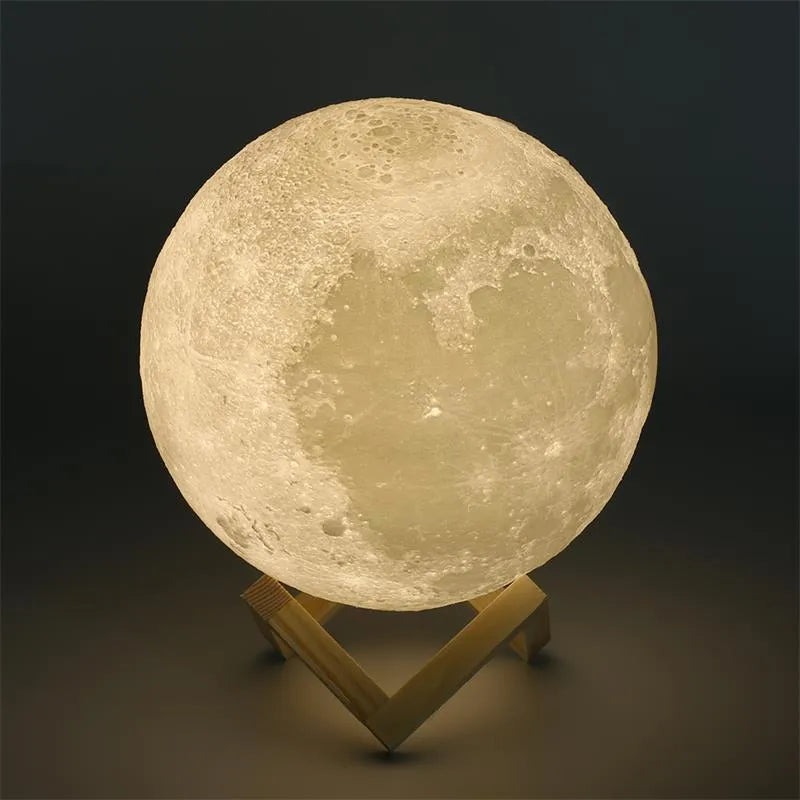 3D printed white moon lamp on wooden stand with touch-sensitive metal ring at base.