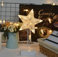 Rattan constructed LED table lamp with star-shaped design and flashing lights for room decoration