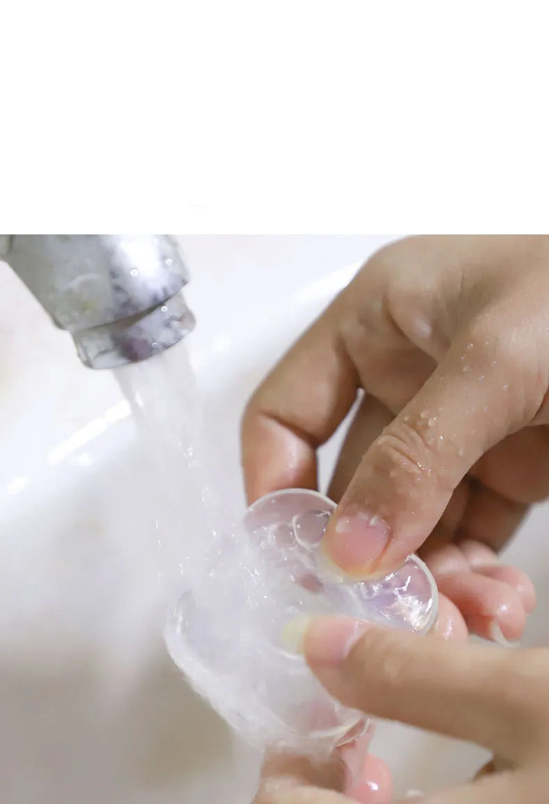 Transparent circular and square silicone nano gel adhesive pads on a smooth surface