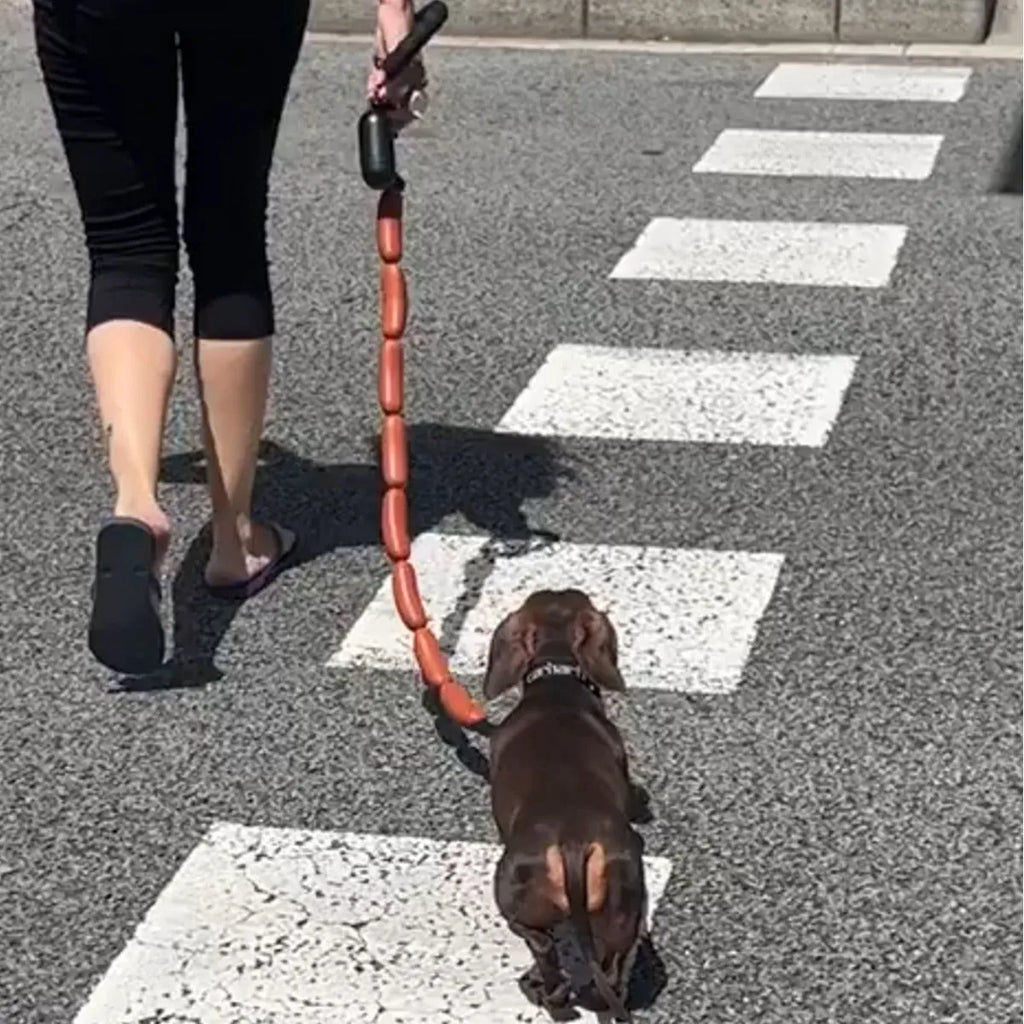 Brown nylon cat toy leash with large sausage segments and a black grip tape handle, shown at full 108cm length.