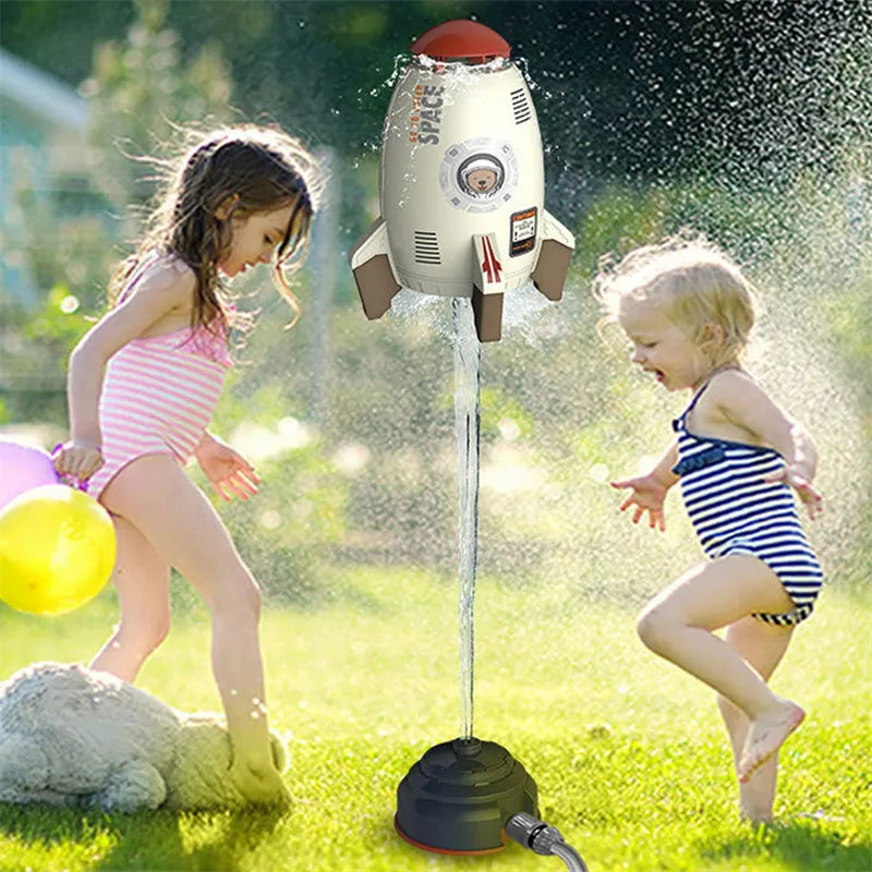 Water pressure powered rocket launcher toy with rotating sprinkler for outdoor garden use