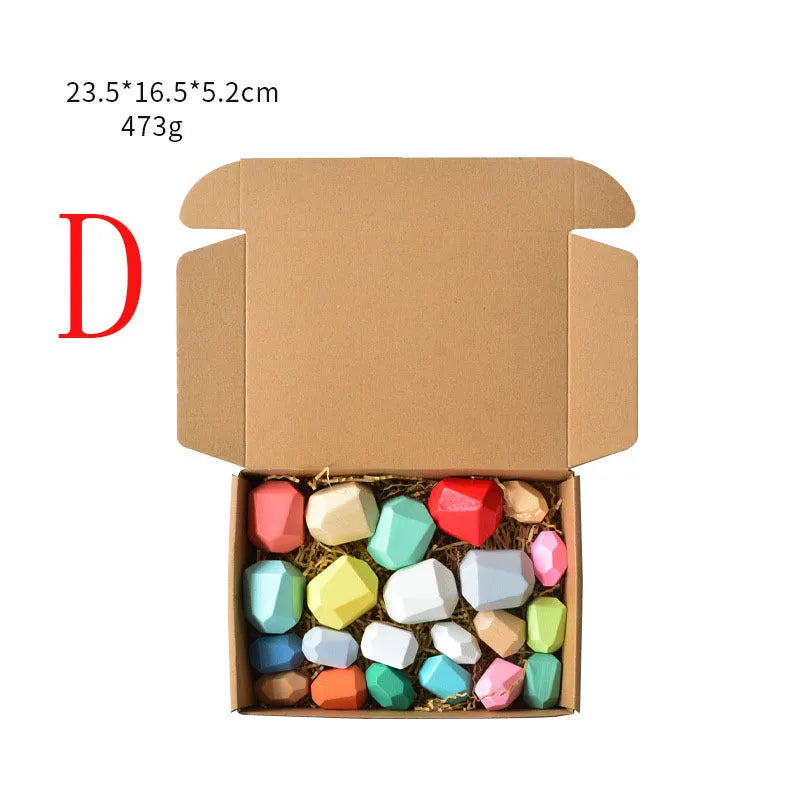 Wooden building block set with coloured and natural stone stacks on a table, suitable for children aged 4-6