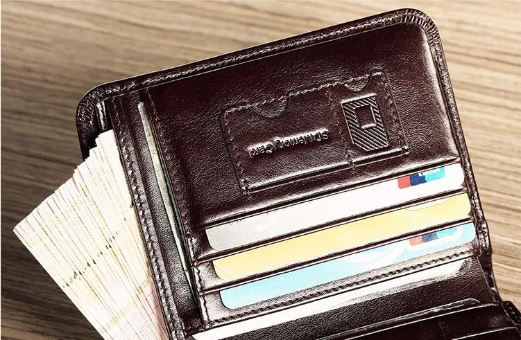 Men's black leather bi-fold wallet open to show card slots, banknote compartment, and coin pocket.
