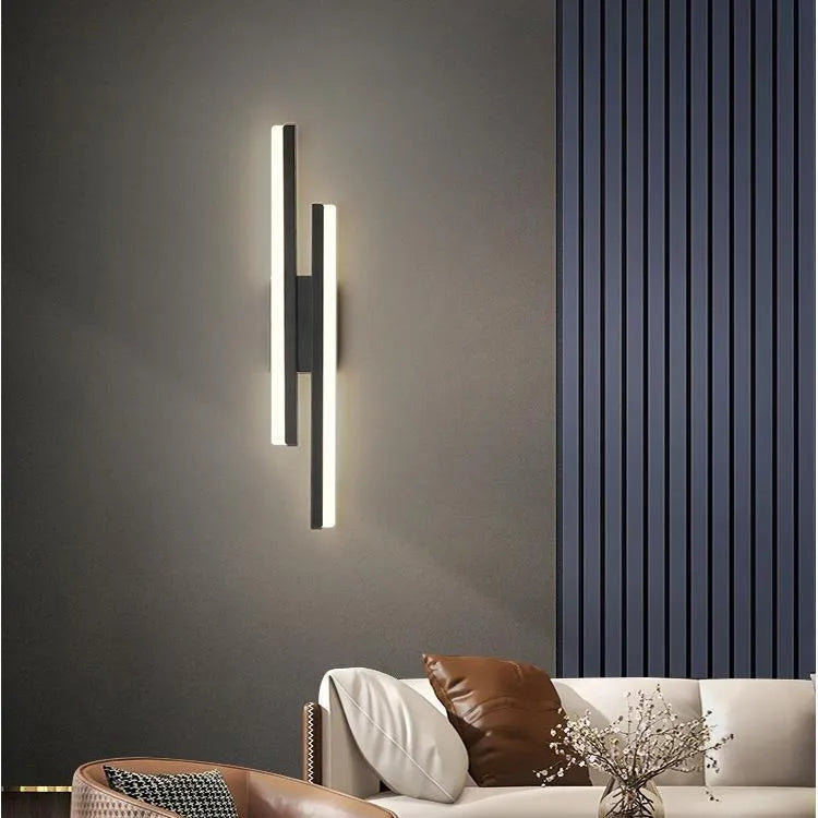 Modern minimalist Scandinavian LED wall light with acrylic shade in black or gold finish, shown in 48cm, 50cm, and 65cm sizes.