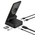 Black USB-C docking station with integrated bracket stand for laptops, featuring USB and HDMI ports, on a desk