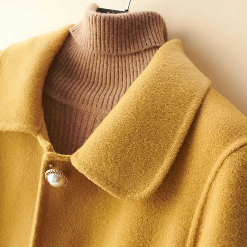 Women's wool mid-length coat with doll collar and pearl buckle in solid colour options