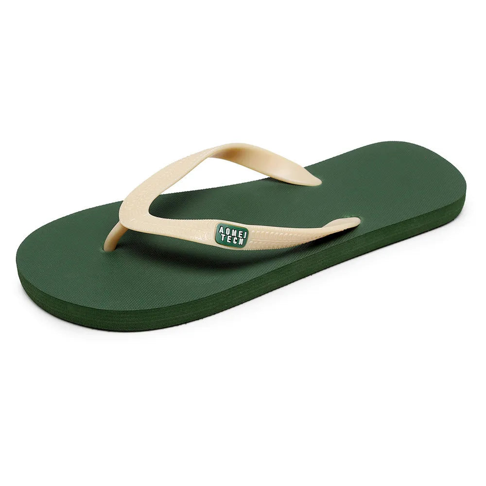 Men's black flip-flops with a textured rubber sole and EVA foam upper on a sandy beach.