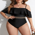 Women's solid black one-piece polyester swimsuit on a hanger