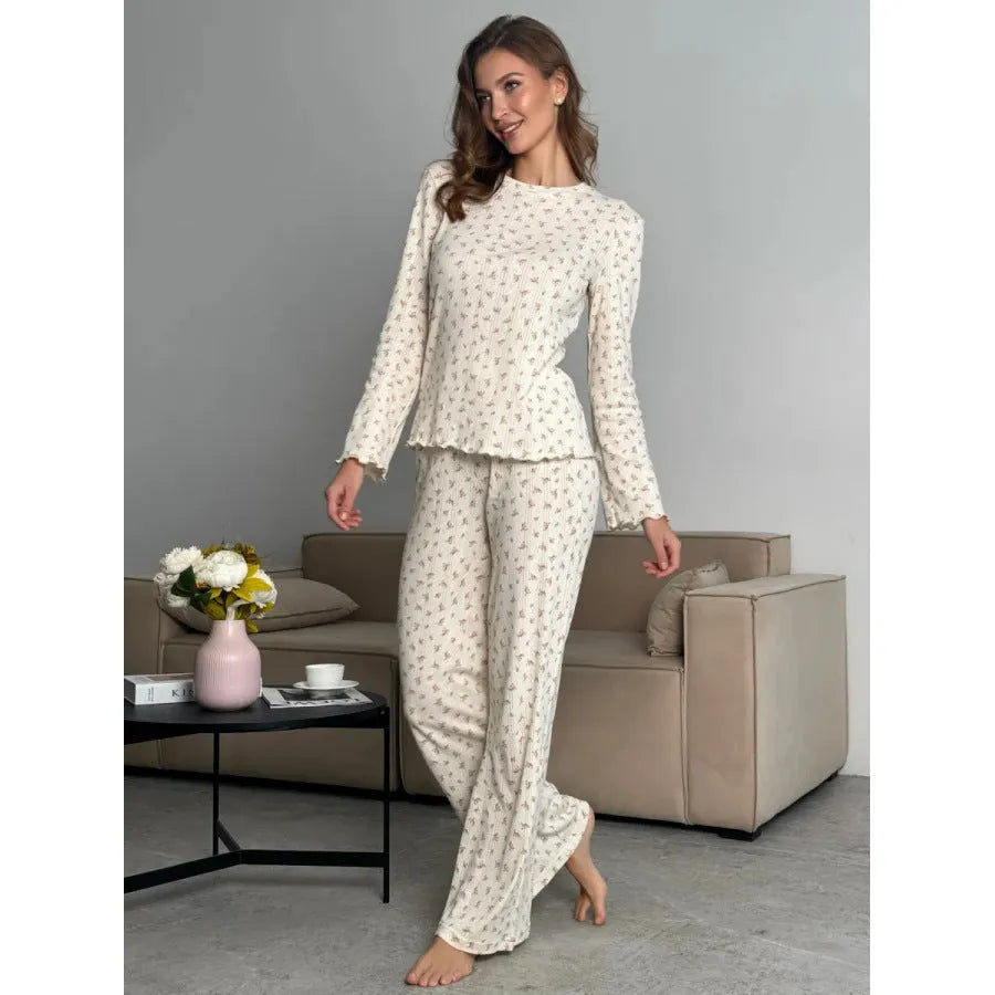 Women's white floral print bell sleeve round neck top and wide leg pants loungewear suit on model