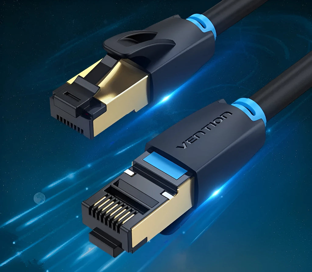 Flat and round styles of a black Cat8 shielded Ethernet cable with RJ45 plugs on a wood desk.