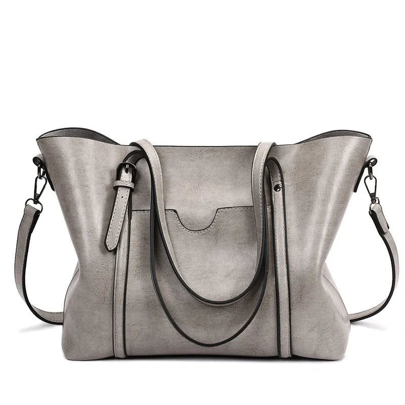 Brown retro-style women's PU leather messenger bag with a top handle and long shoulder strap.